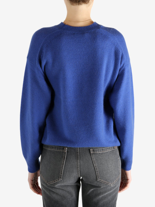 blue sweater worn by a person, showing the sweater fit