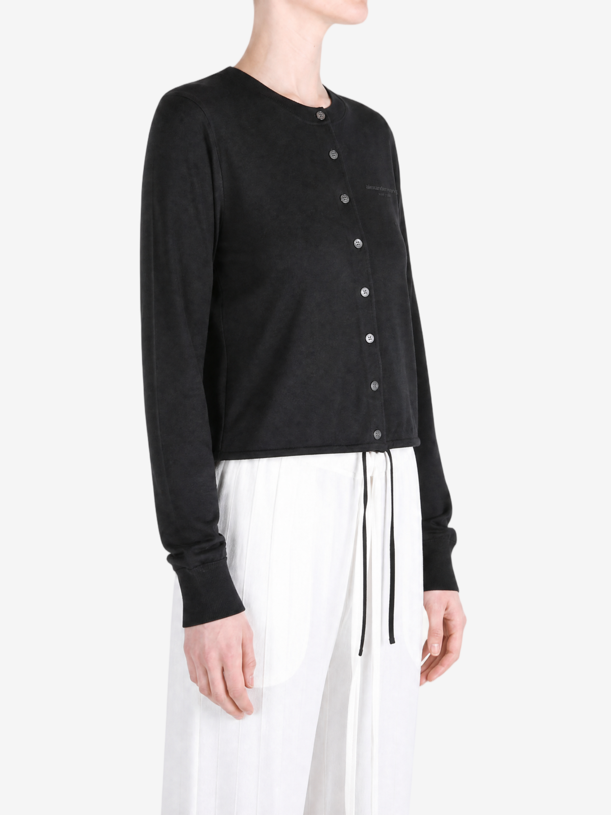 Black jacket worn by a person, showing the jacket fit