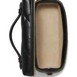 Close up of the black bag, showing texture of the leather fabric