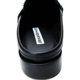 Close up of black Loafer, showing texture of the leather fabric