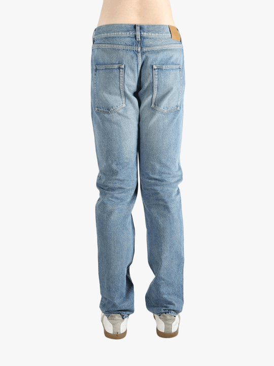 Blue jean worn by a person, showing the fit