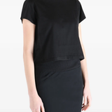Black t-shirt worn by a person, showing the t-shirt fit
