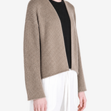 Tan jacket worn by a person, showing the jacket fit