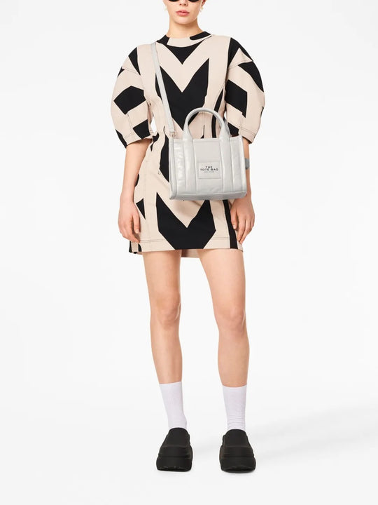 White bag worn by a person, showing the bag's fit