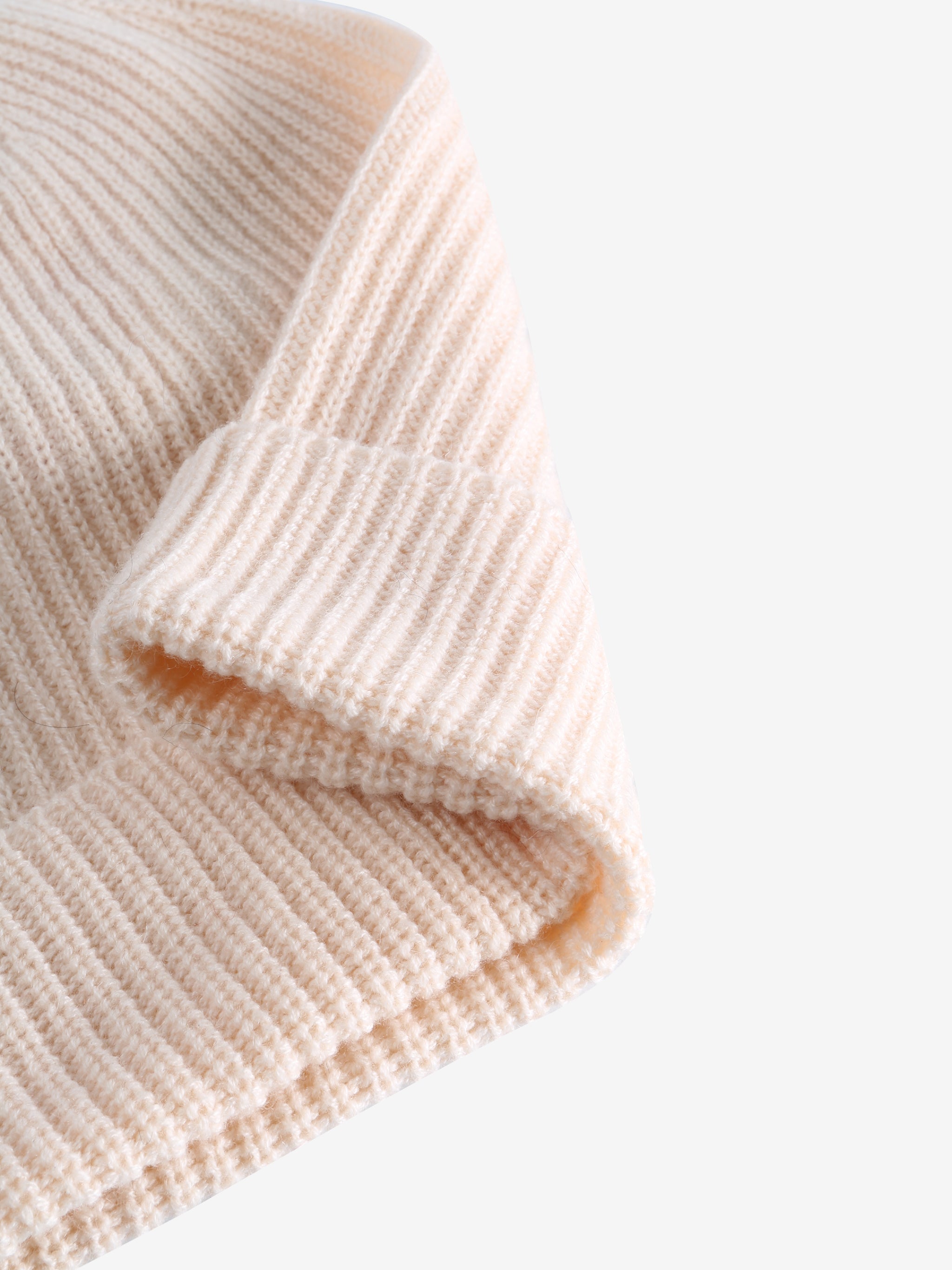 Close up of white hats, showing texture of the fabric