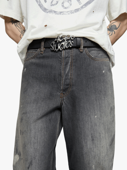 Black jeans worn by a person, showing the jeans fit