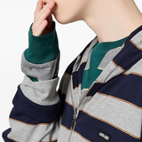 Close up of green t-shirt, showing texture of the cotton fabric