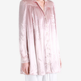 Pink dress worn by a person, showing the dress fit