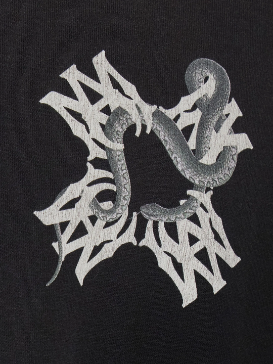 Close up of black t-shirt, showing texture of the cotton fabric