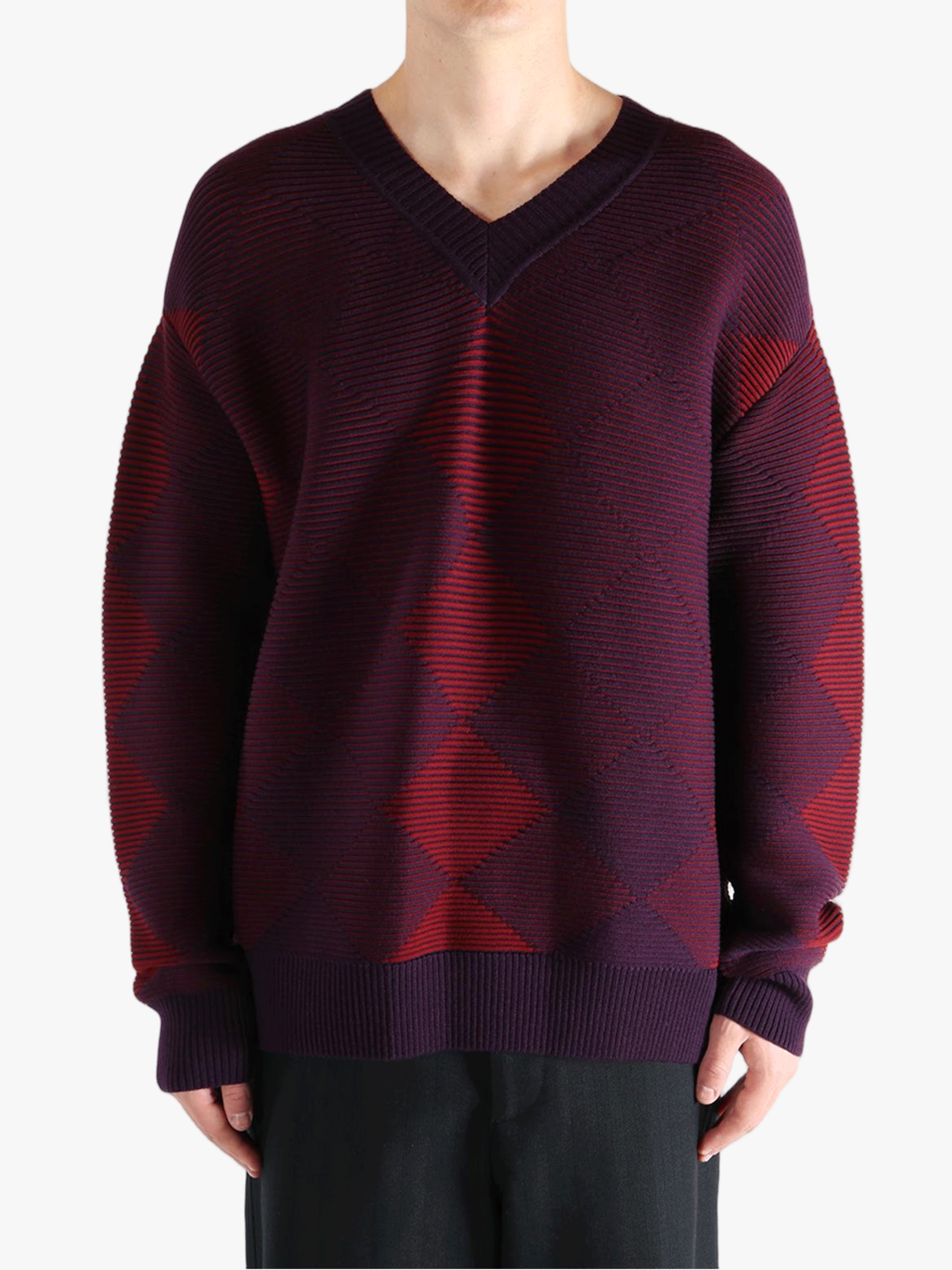 Red sweater worn by a person, showing the sweater fit