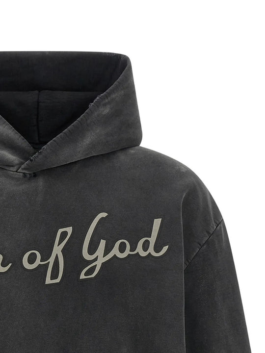 Close up of Black hoodie, showing texture of the 100% cotton fabric