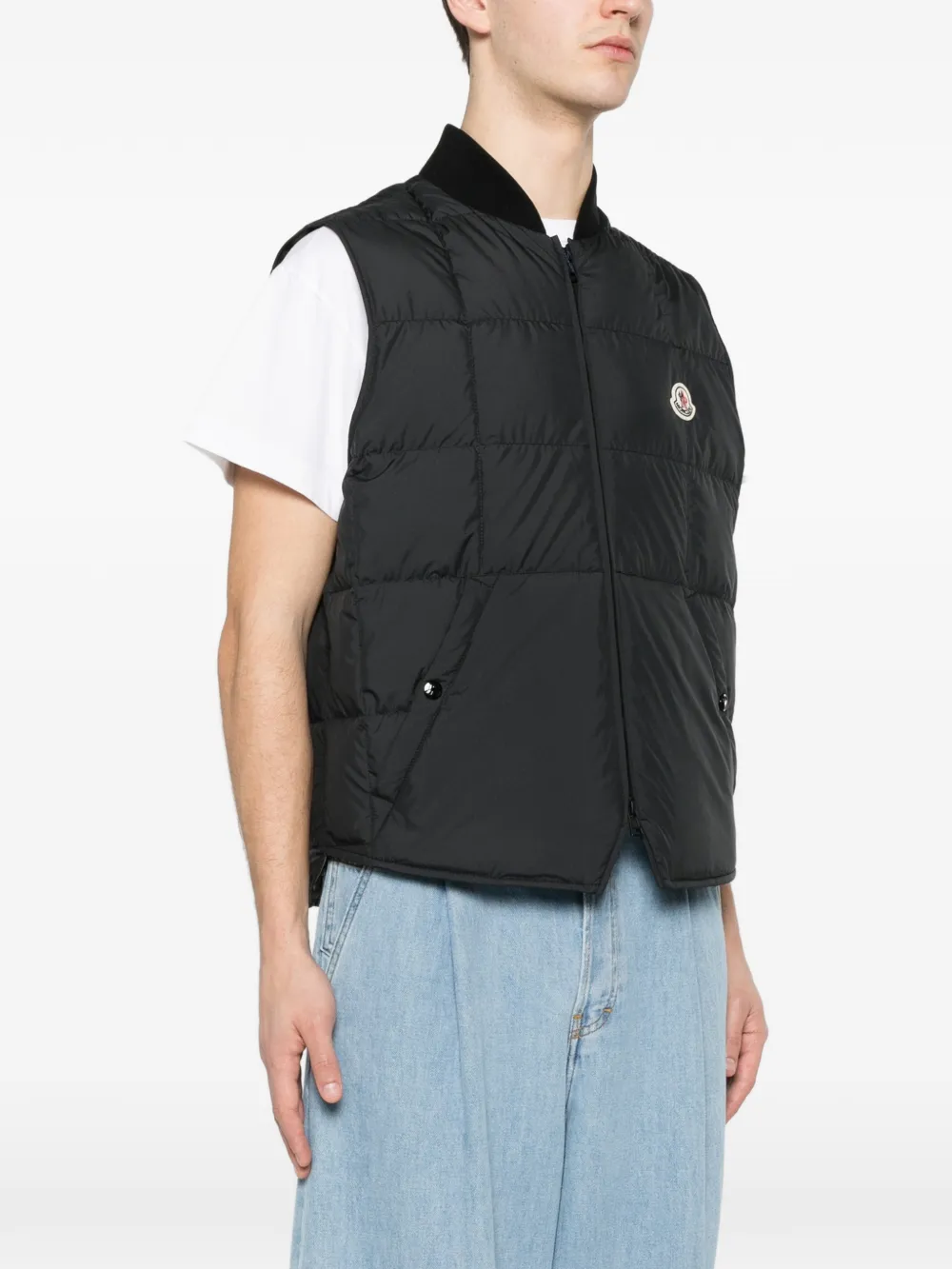 Black jackets-coats worn by a person, showing the jackets-coats's fit