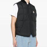 Black jackets-coats worn by a person, showing the jackets-coats's fit