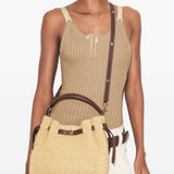 Tan bags worn by a person, showing the bags' fit 