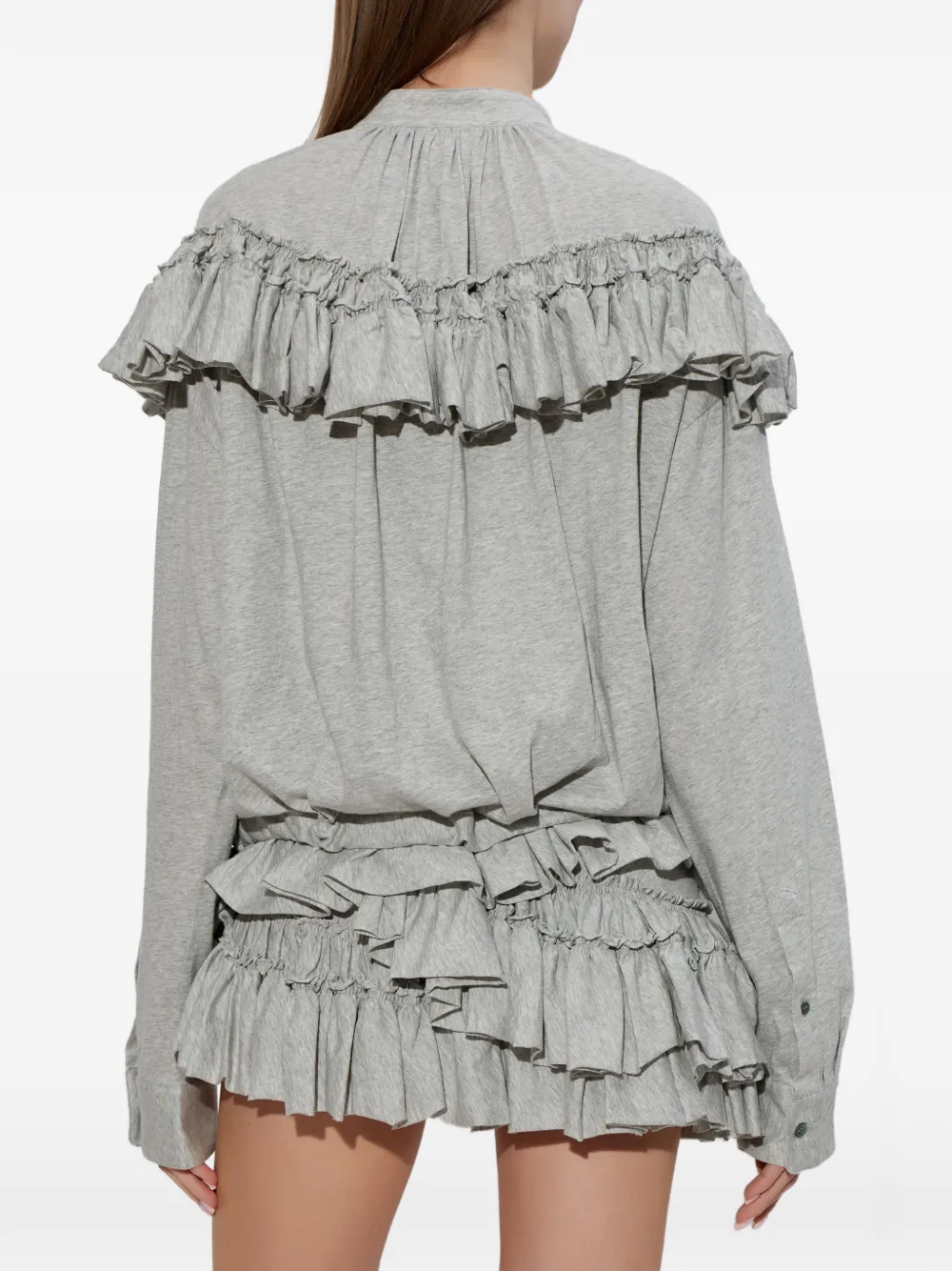 Grey top worn by a person, showing the top fit