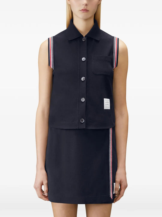 Navy shirt worn by a person, showing the shirt fit