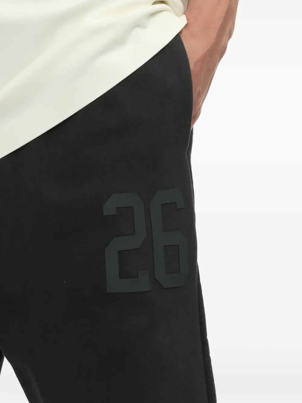 Close up of the black pants, showing texture of the cotton fabric