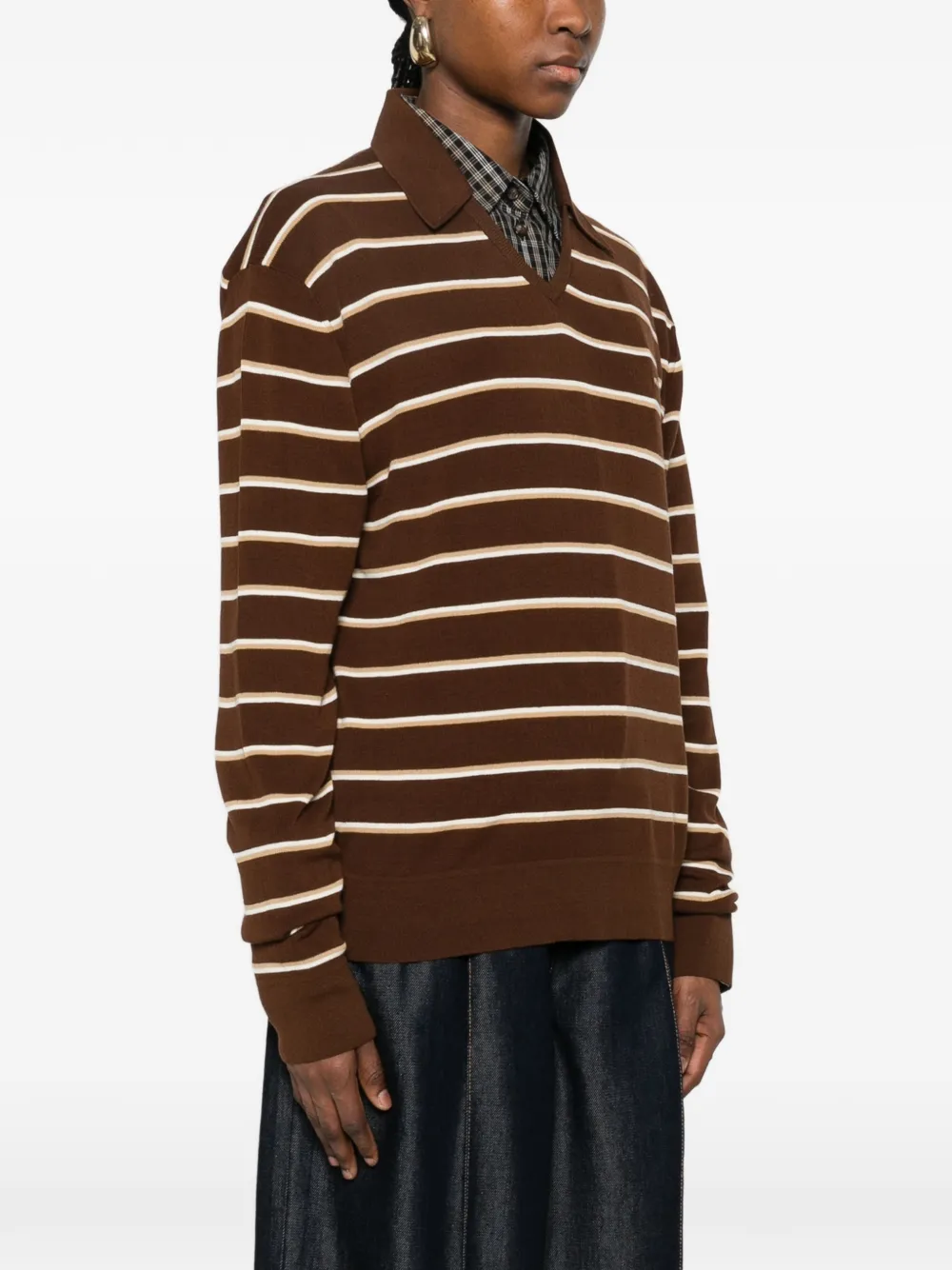 Brown shirt worn by a person, showing the shirt's fit