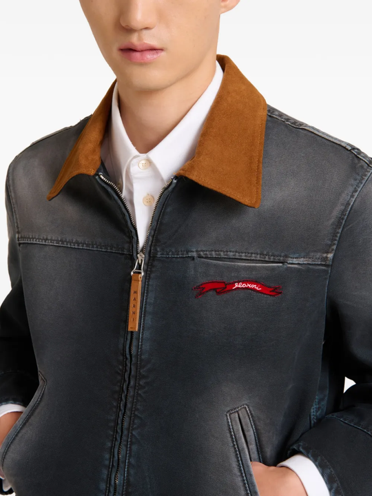 Close up of black jacket, showing texture of the Cotton fabric