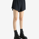 Black shorts worn by a person, showing the shorts' fit