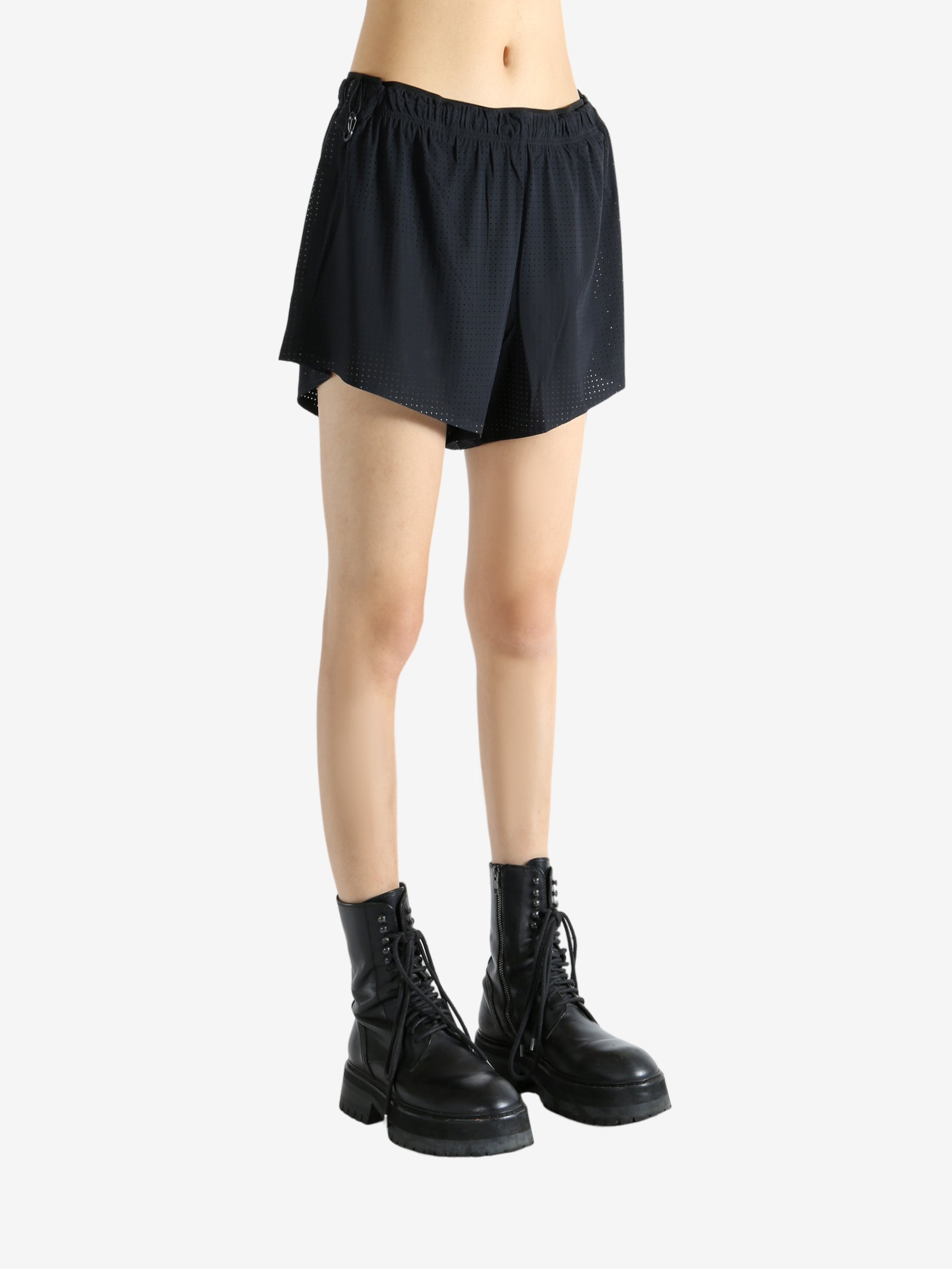 Black shorts worn by a person, showing the shorts' fit