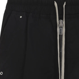 Close up of black pant, showing texture of the cotton fabric