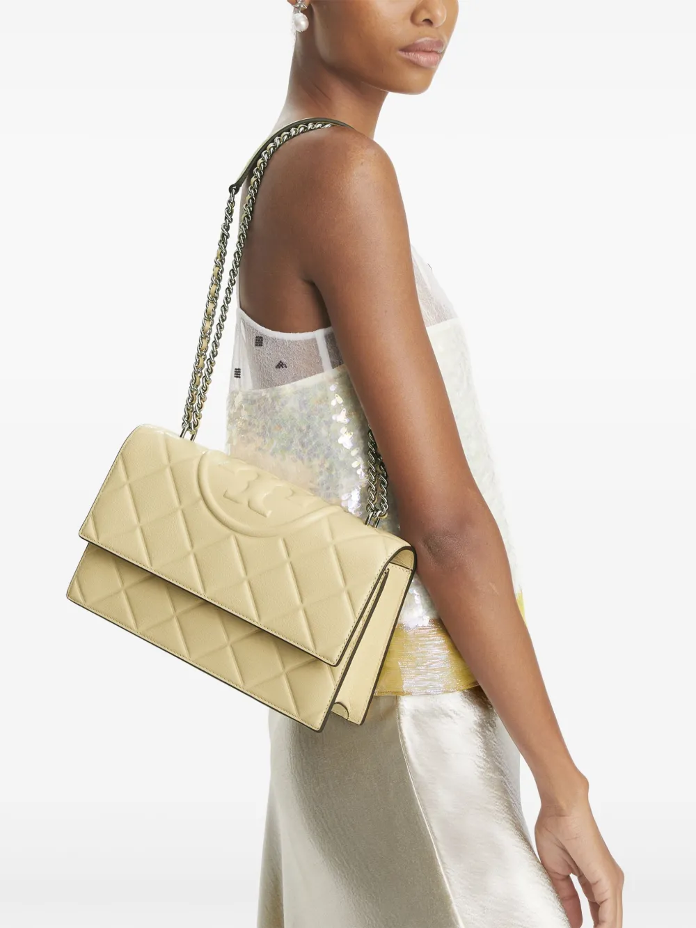 Yellow bag worn by a person, showing the bag's fit