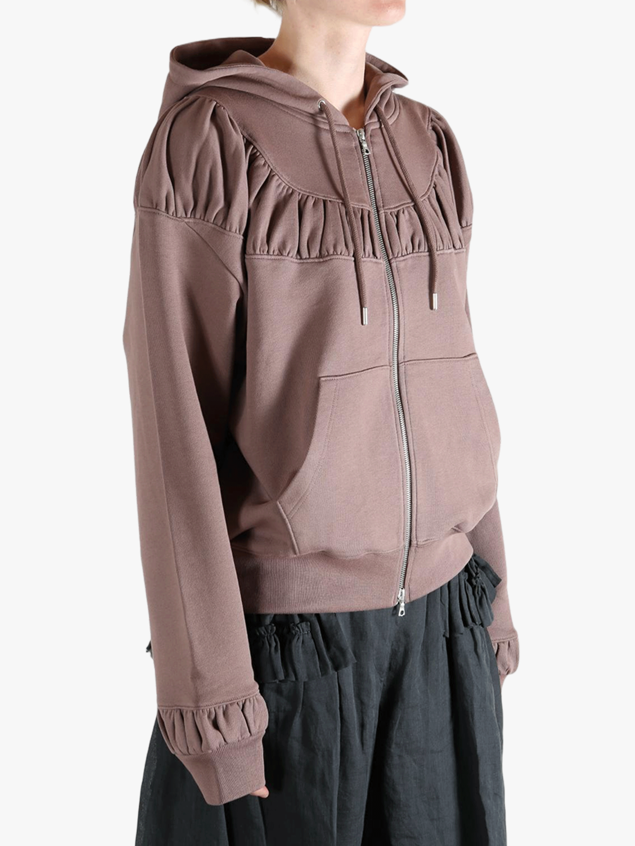 Tan hoodies worn by a person, showing the hoodies fit