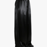 Black pants worn by a person, showing the pant's fit