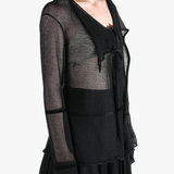 Black shirt worn by a person, showing the shirt fit