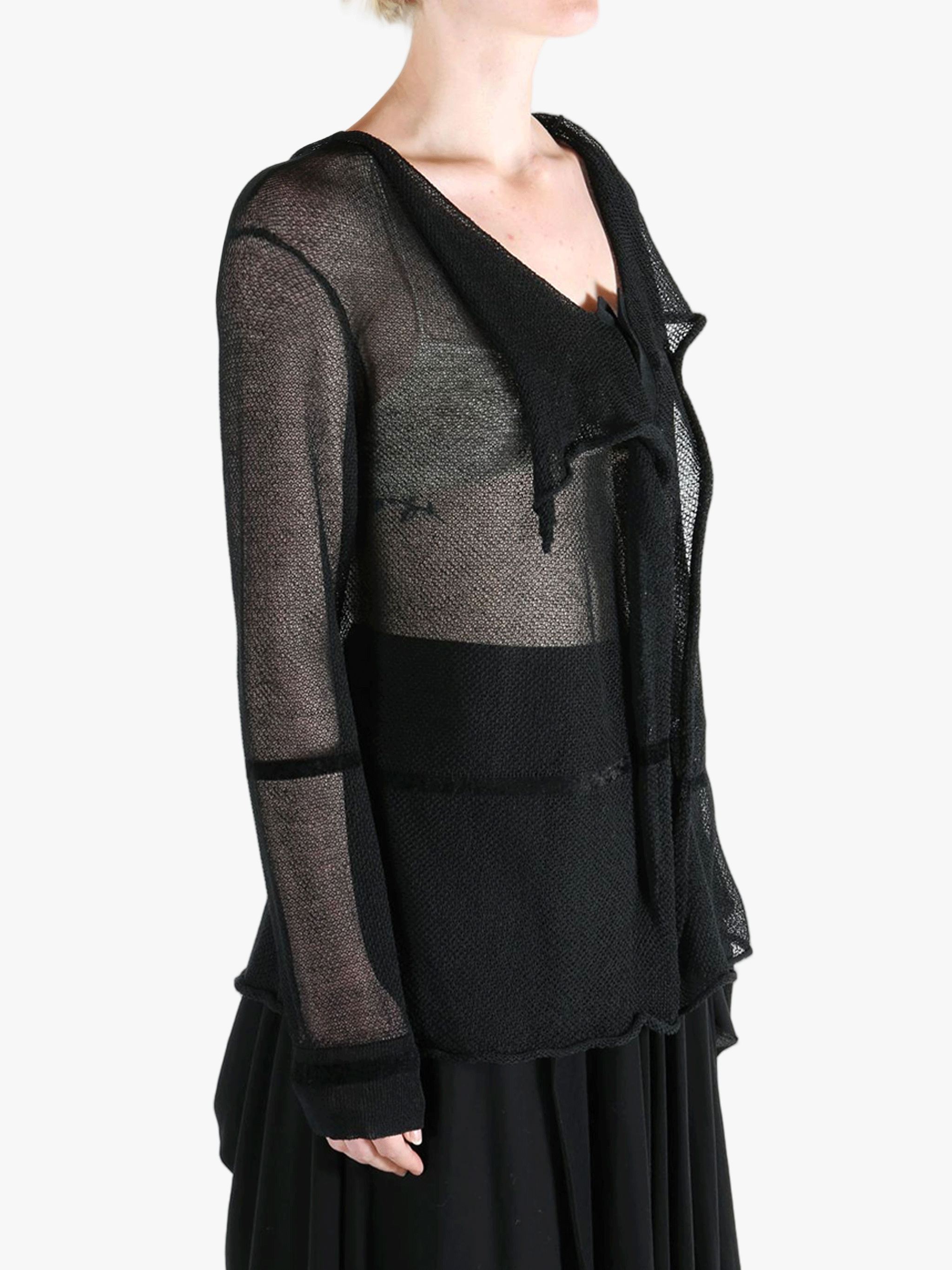 Black shirt worn by a person, showing the shirt fit