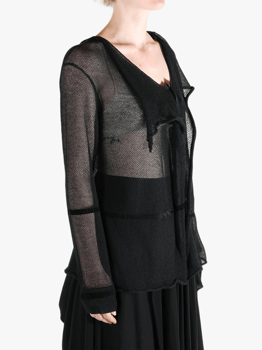 Black shirt worn by a person, showing the shirt fit