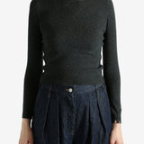 Grey sweater worn by a person, showing the sweater's fit