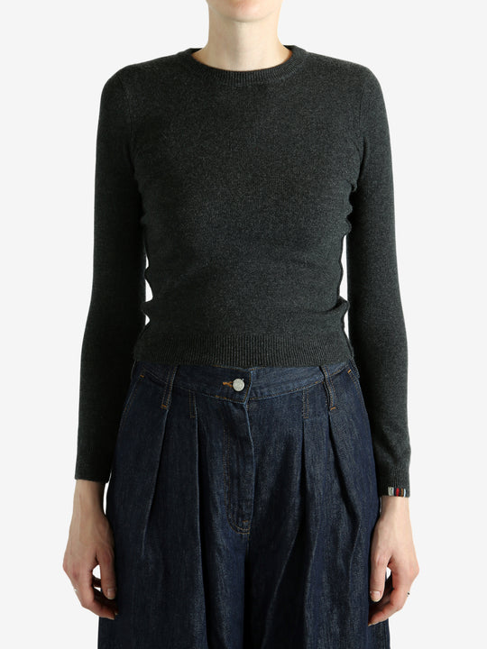 Grey sweater worn by a person, showing the sweater's fit