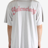 White t-shirt worn by a person, showing the t-shirt's fit