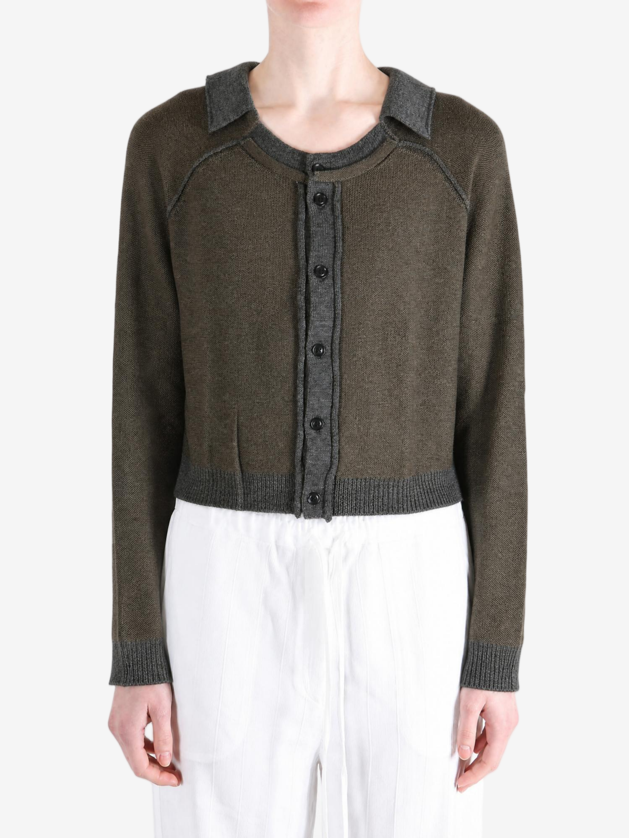 Green top worn by a person, showing the top fit