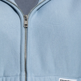 Close up of blue hoodie,showing texture of the cotton fabric.