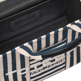 Close up of blue bag, showing texture of the cotton fabric