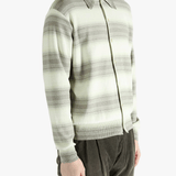 Green sweater worn by a person, showing the sweater's fit