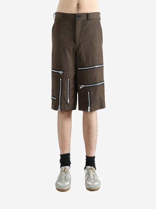 Brown shorts worn by a person, showing the shorts' fit