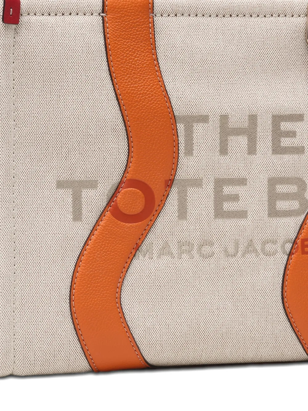 Close up of the tan bag, showing texture of the cotton fabric