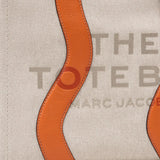 Close up of the tan bag, showing texture of the cotton fabric
