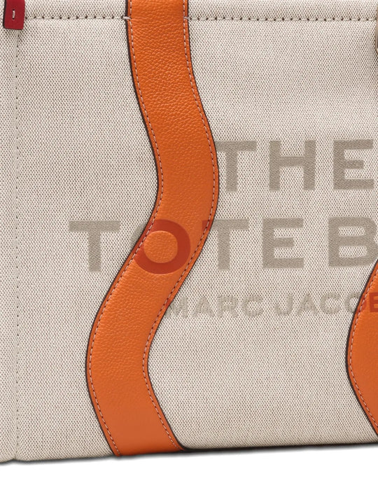 Close up of the tan bag, showing texture of the cotton fabric