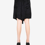 Black pant worn by a person, showing the shirt fit