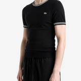 Black hoodie worn by a person, showing the hoodie fit