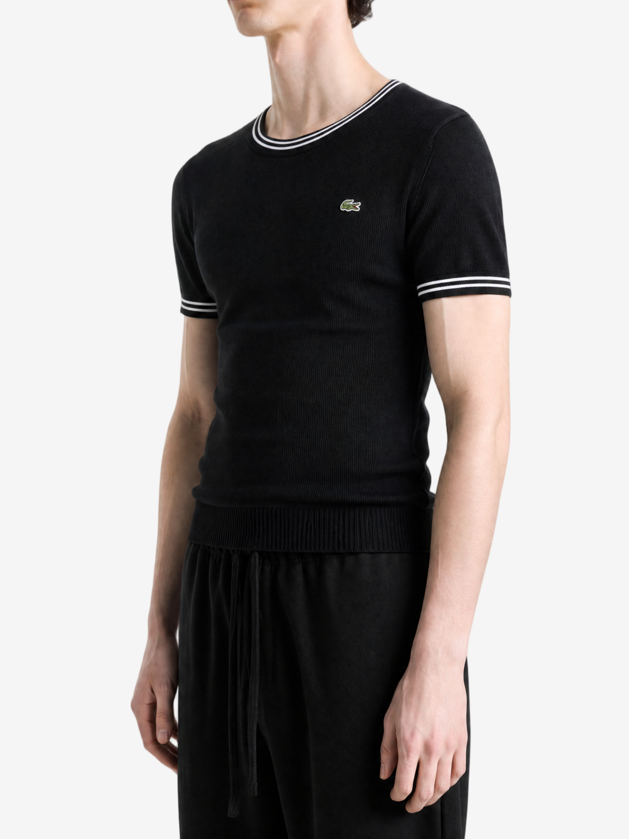 Black hoodie worn by a person, showing the hoodie fit