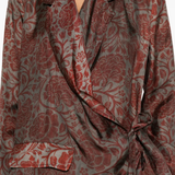 Close up of red jacket,showing texture of the viscose fabric.