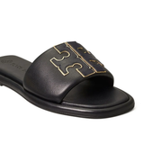 Close up of black sandals, showing texture of the calf leather fabric