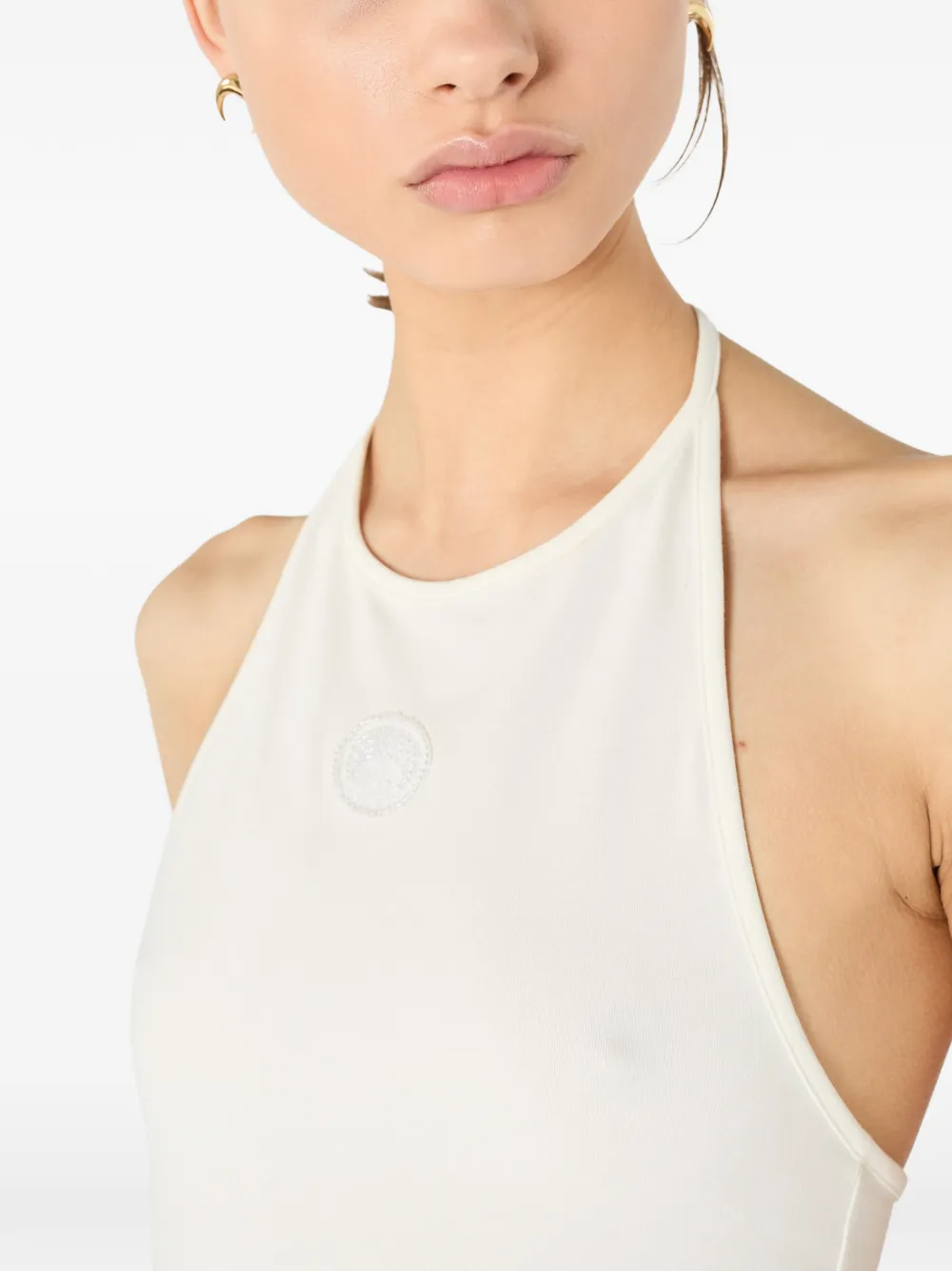 Close up of white tops, showing texture of the cotton fabric