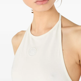 Close up of white tops, showing texture of the cotton fabric